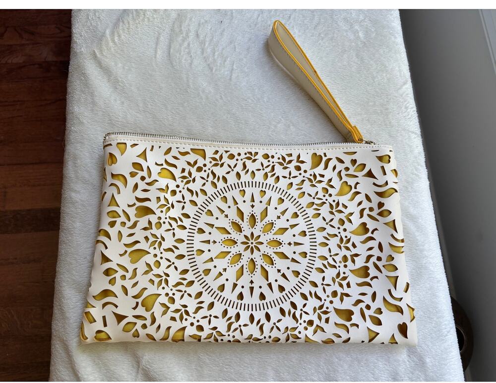 Carlos Santana Laser Cut Wristlet Clutch in Ivory with Yellow Interior